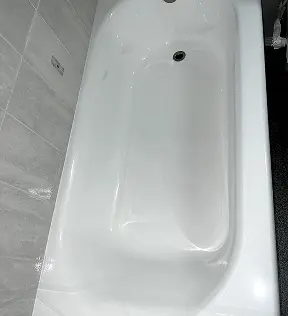 Professional bathtub refinishing with smooth glossy finish in Home