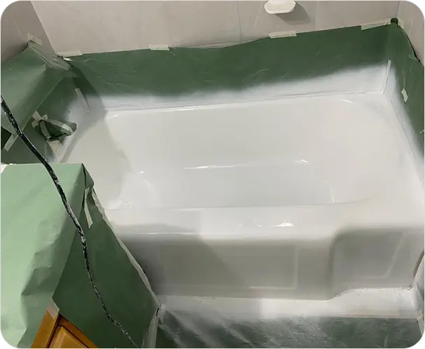 Refinished bathtub surface featuring a bright like-new shine