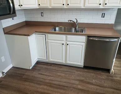Kitchen cabinet set before resurfacing – stained and uneven surface