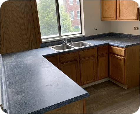Restored bathroom vanity top with polished refinished surface.
