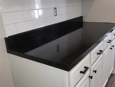 Stone-look countertop before restoration – dull shine and surface damage.