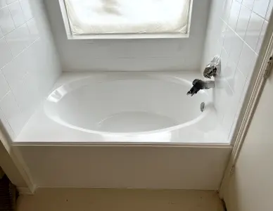 Bathtub after refinishing with smooth glossy coating