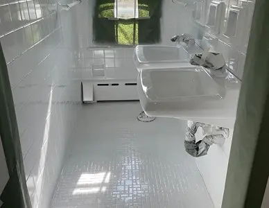 Tile walls after reglazing featuring a clean polished coating