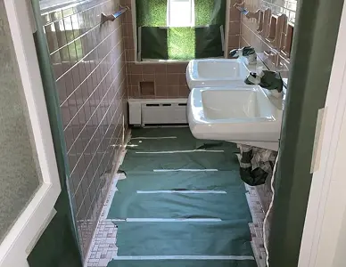 Tile walls before reglazing with chipped and faded coating