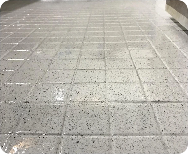 Restored bathroom tiles featuring a fresh glossy coating