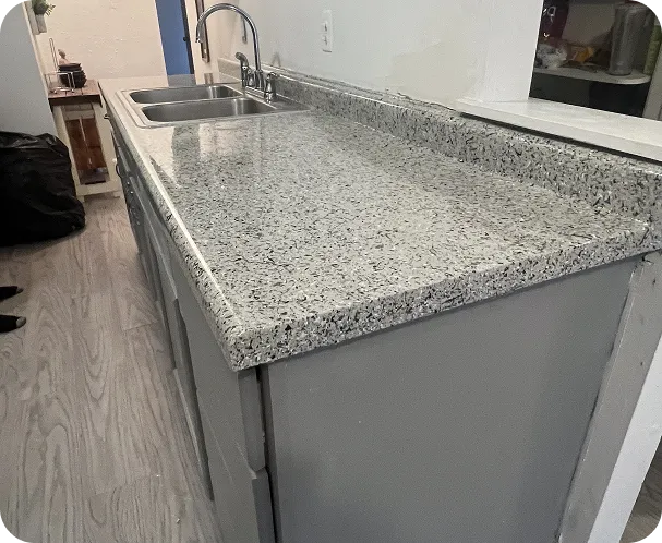 Refinished countertop surface featuring a glossy renewed look