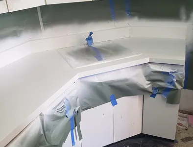 Refinished kitchen cabinet doors after reglazing – clean, glossy new look.