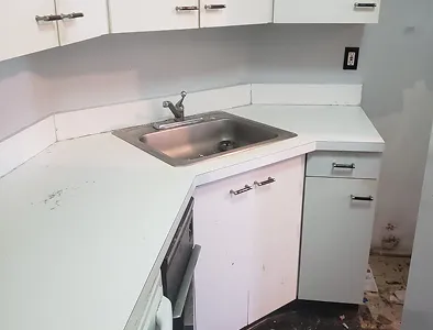 Old kitchen cabinet doors before reglazing – scratches and dull finish.