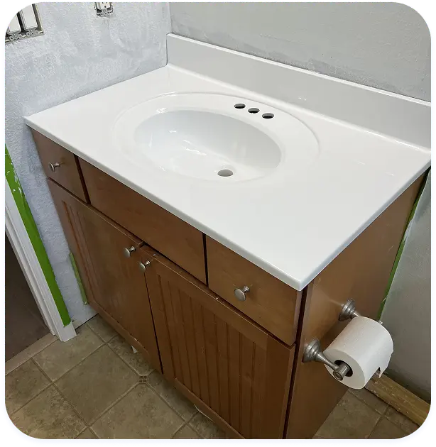 Professional sink refinishing service restoring a smooth glossy finish