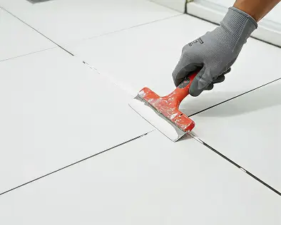 Tile regrouting service with restored clean grout lines in Home