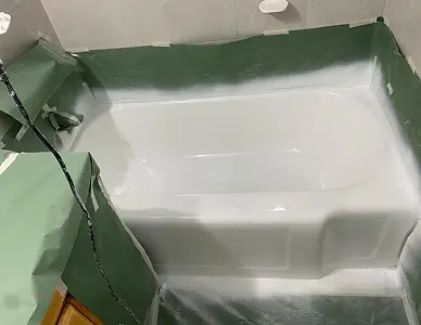 Bathtub after reglazing featuring a modern polished surface